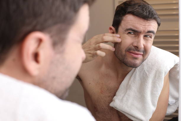 istock Man observing his image in the mirror 1471933624