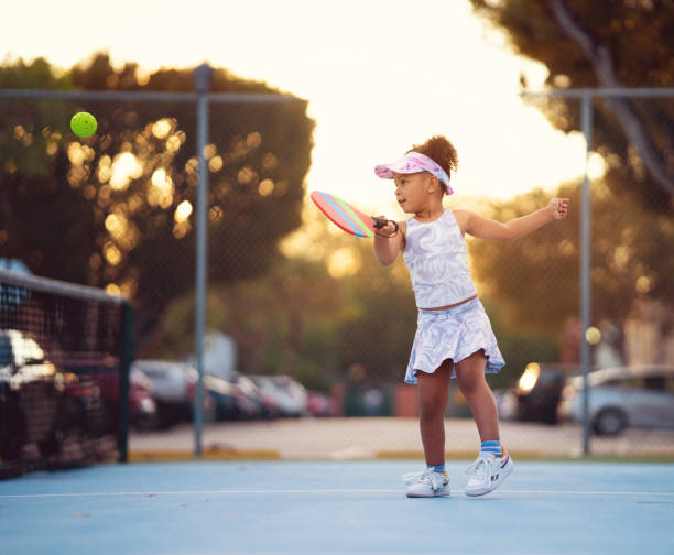 istock Active latin girl returning a serve at pickle ball practice 1471933885