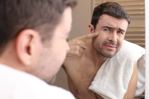 istock Man observing his image in the mirror 1471934792