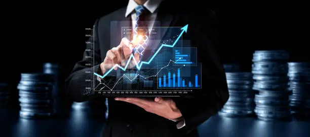 Businessman analyst working with digital finance business data graph showing technology of investment strategy for perceptive financial business decision. Digital economic analysis technology concept.