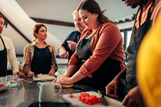 istock Woman making dough in cooking class. 1471937450