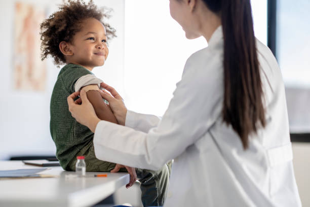 Boy Receiving a Vaccination stock photo