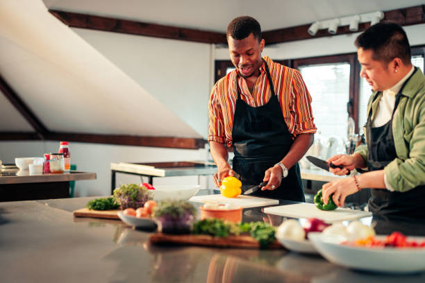 istock Cheerful friend learning to cook together. 1471940399