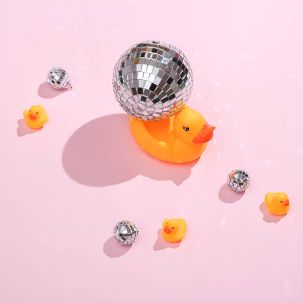 istock Creative medicine layout. Rubber ducks with disco balls on a pink background. Retro aesthetics of the 80s. Surreal idea. Party concept. Conceptual pop 1471940540