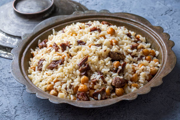 istock Traditional Turkish food; Roasted meat on rice (Turkish name; pilav üstü kavurma, kurban kavurma, nohutlu etli pilav) 1471940772