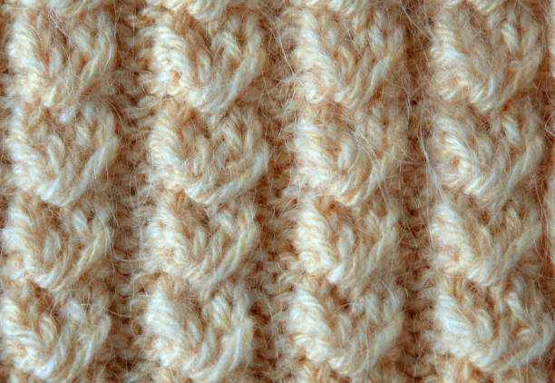 beige wollpullover stoff textur mit muster - cashmere texture stock-fotos und bilder