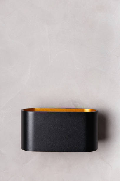 istock black wall lamp on gray wall copy space 1471941732