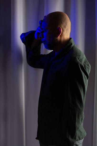 istock Man standing, worried and thoughtful. Studio portrait. 1471945299