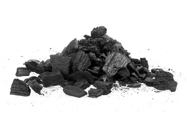 istock Pile of charcoal pieces isolated on a white background. Xylanthrax. 1471947543