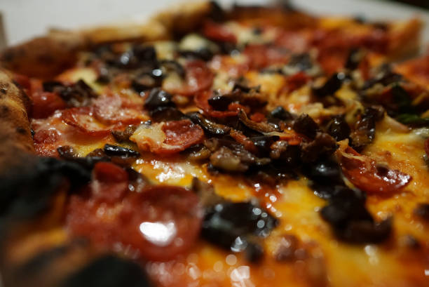 istock Pizza with eggplant, mozzarella and salami. 1471947648