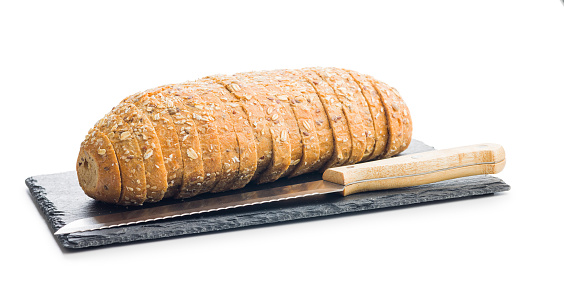 Sliced whole grain bread. Tasty wholegrain pastry with seeds isolated on the white background.