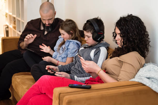istock Family time on week-end at home with mobile devices. 1471954137
