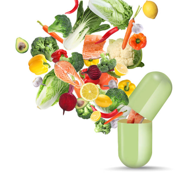 istock Dietary supplements. Capsule and different fresh vegetables, fruits and fish flying on white background 1471954267