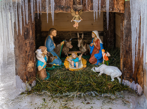 San Pietro di Cadore, Italy - December 12, 2022: Outdoor Christmas nativity scene in ice in San Pietro di Cadore