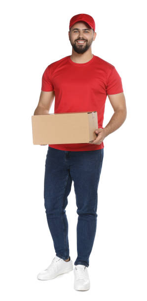 istock Happy young courier with cardboard box on white background 1471959904