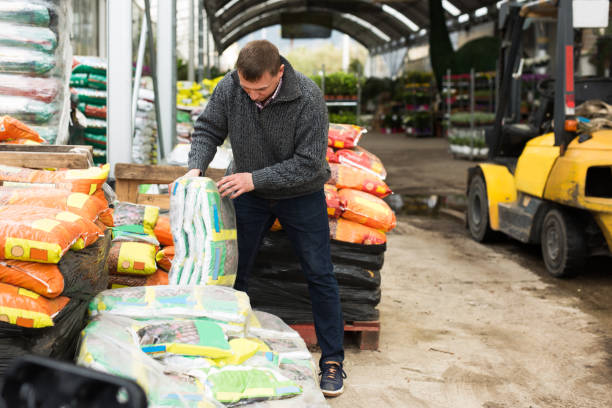 istock worker unloading garden substrates in gardening store 1471967957
