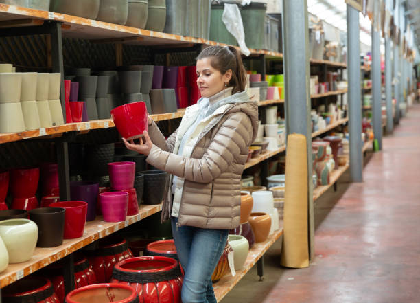 istock Woman choosing pot for plants 1471968052