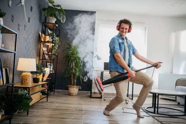istock Musician with a vacuum cleaner 1471971835