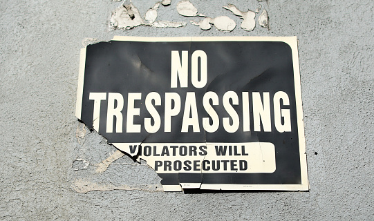 No Trespass sign in front of private property depicting security, privacy, and protection