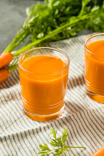 Cold Refreshing Raw Carrot Juice Ready to Drink in a Glass