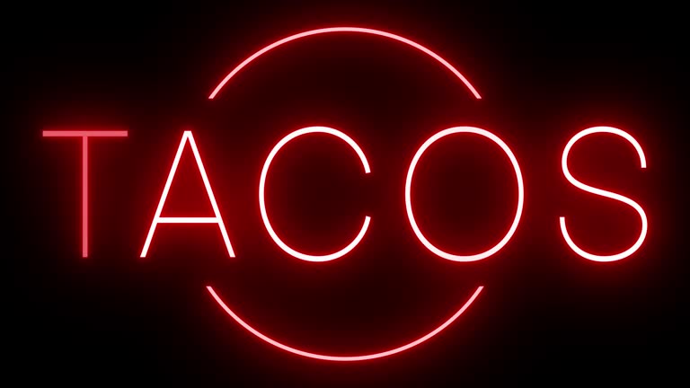 Glowing and blinking red retro neon sign for TACOS