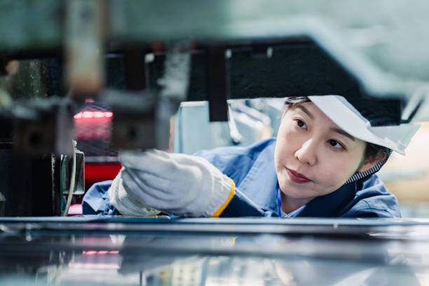 istock A female technician maintaining and inspecting machinery 1471990739