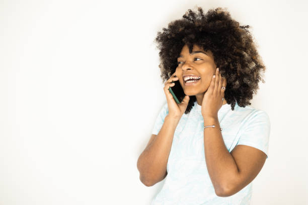 istock Young woman using smartphone at home 1471990890