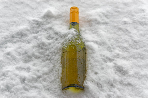 istock a nice bottle of white wine in the cold snow. 1471991631