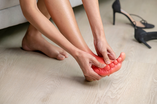 Closeup female foot pain, Healthcare concept.