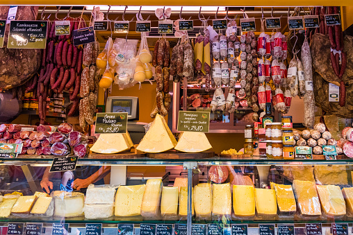 Bolzano, Italy - Aug 23, 2019 - Great choice of meat and cheese products on the market in the historical part of the city