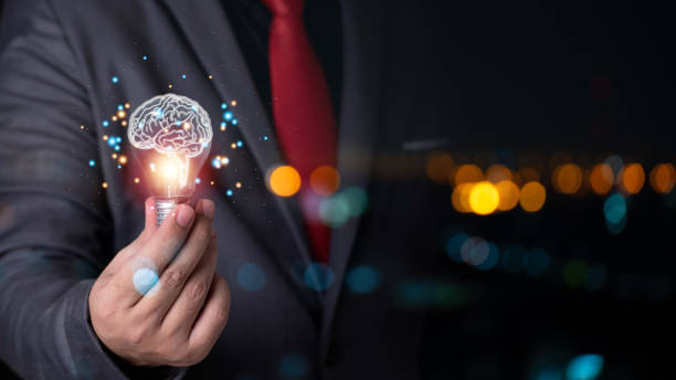istock business man hand holding brain light bulb , business ideas concept 1471999781
