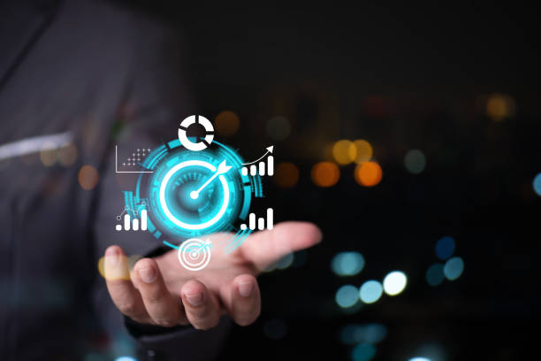 istock man hand holding virtual target business graph icon on screen , business target point 1471999805