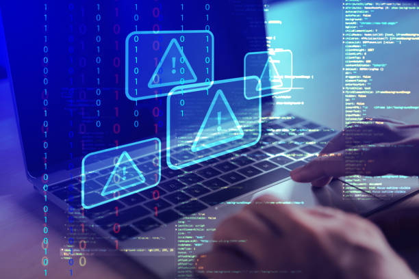 istock man hand on laptop with exclamation mark on virtual screen, online safety warning , caution warning sing for notification error 1471999877