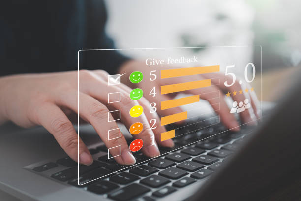 istock Customer rate their satisfaction ranking for experience review survey with smart phone and laptop. 1471999883