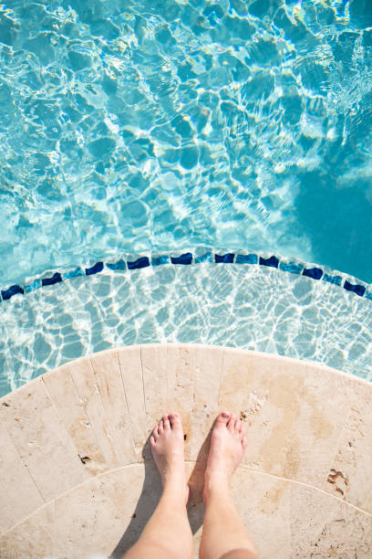 istock First person view of feel poolside on vacation 1472003081