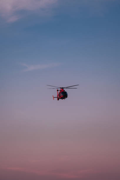 istock helicopter in the sky sky sunset 1472003661