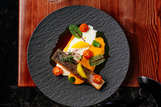 istock grilled salmon steak with sauce in a plate on a wooden table 1472003704