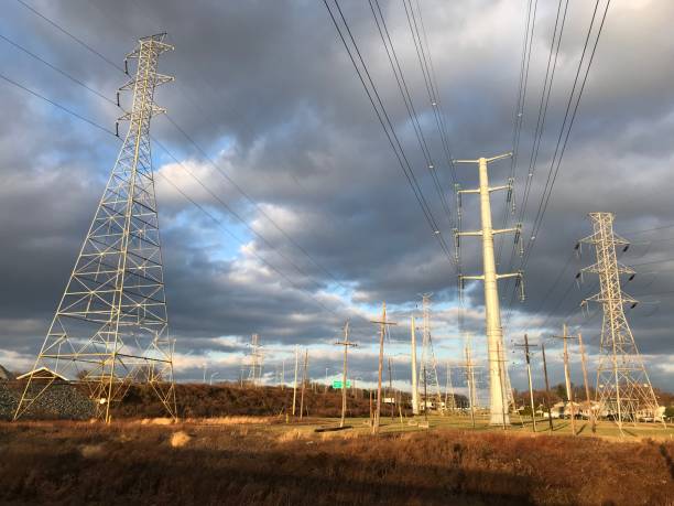 istock Tall Pylons under Cloudy Skies 1472003835