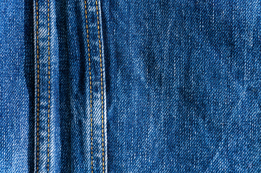 Blue denim with seams and light stains close up in Nazaré, Leiria District, Portugal
