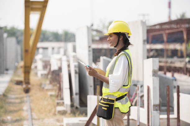 istock Foreman builder woman at construction site. Asian foreman construction woman working at construction site 1472008918