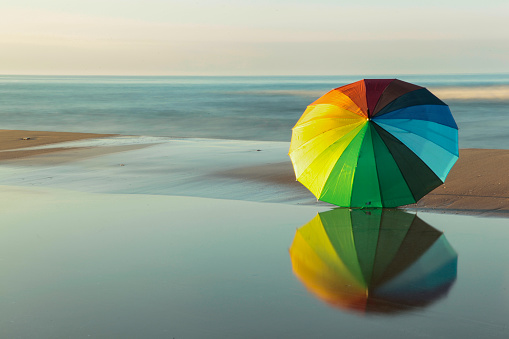 Umbrella- colourful umbrella. Blue, yellow, green, red. Summer. Beach umbrella