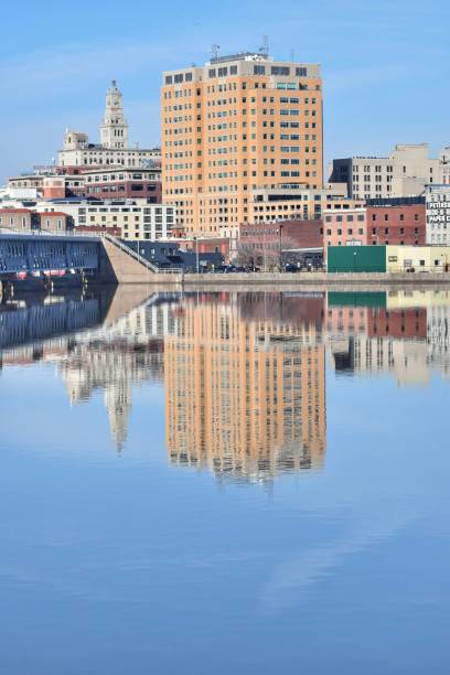 Reflections of Davenport The Davenport, IA skyline reflected in the waters of the Mississippi River davenport iowa stock pictures, royalty-free photos & images