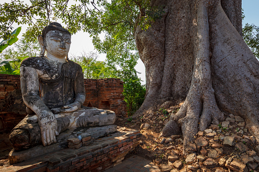 Awa, Mandalay, Myanmar - December 13, 2015: Buddha Statue at the temple ruins of Ava in Myanmar