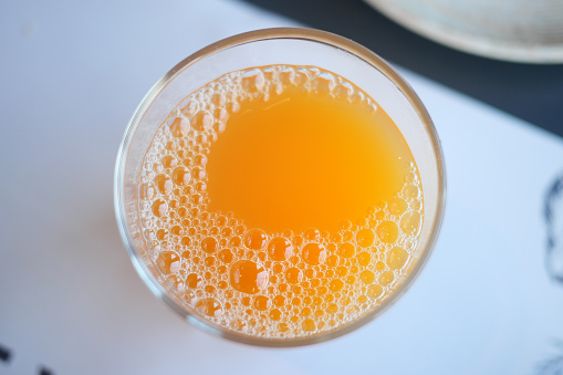 glass of orange juice table ,