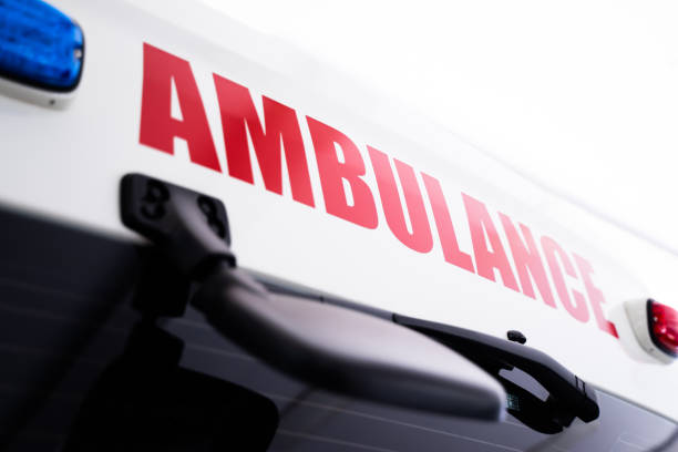 istock Back view of white ambulance with red lettering 1472024028