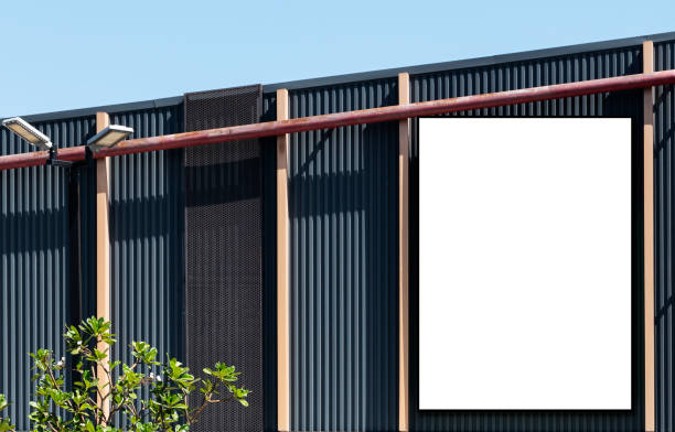 istock Mock up white background billboard and clipping path on building with blue sky background 1472025241