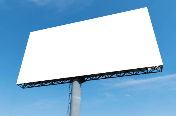 istock Outdoor pole billboard on blue sky background with mock up white screen and clipping path 1472025272