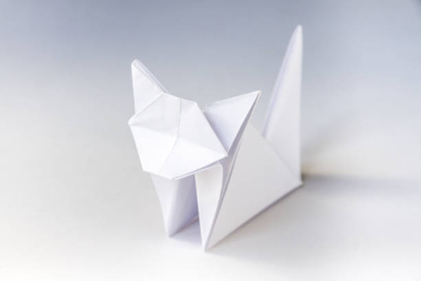 istock Paper cat origami isolated on a white background 1472025378