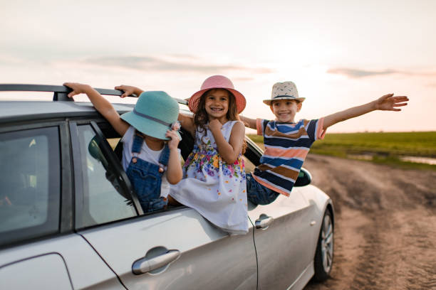 istock Beautiful children enjoying on a road trip 1472026559