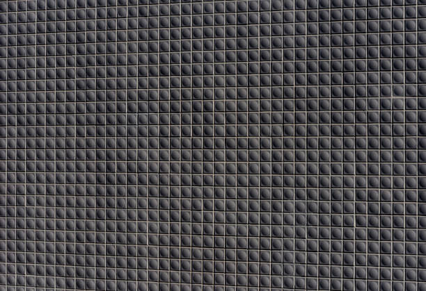 Close-up of dark mosaic tiles texture background.